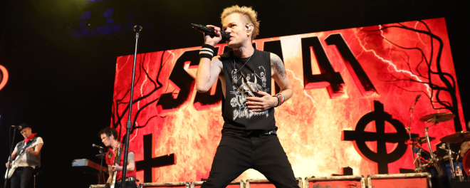 Sum 41 frontmant Derek Whibley performing live onstage