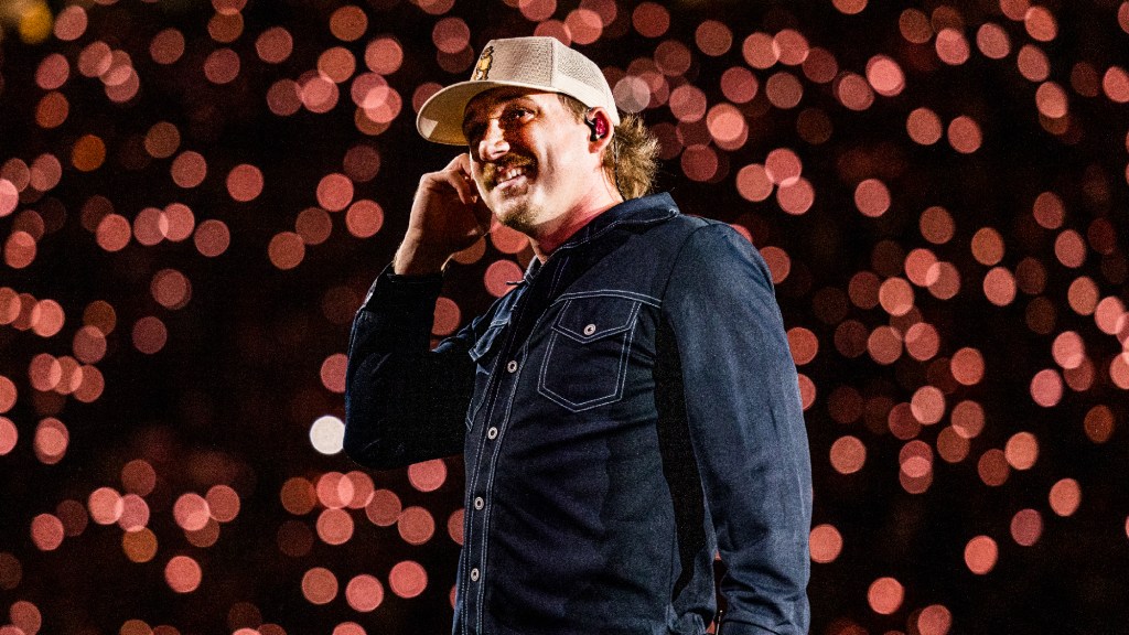 Morgan Wallen Shows Off Bible Verse Written on His Leg Cast During Clemson Concert